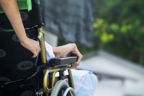 person pushing a wheelchair